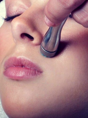 Woman receiving a dermasweep aesthetics skin procedure in Idaho Falls at Rosemark, formally a Bella Dea spa treatment.