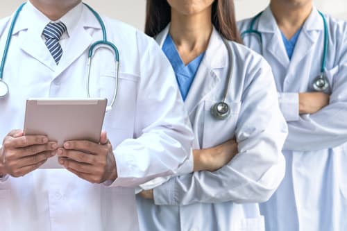 doctors in white lab coats.