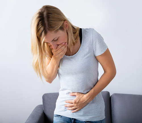 woman with morning sickness in first trimester of pregnancy.