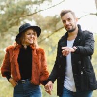 Loving couple holding hands while taking a walk. Click to learn more about our birth control patch clinical study.