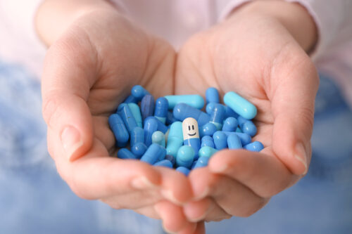 Probiotic clinical study, supplements in hands